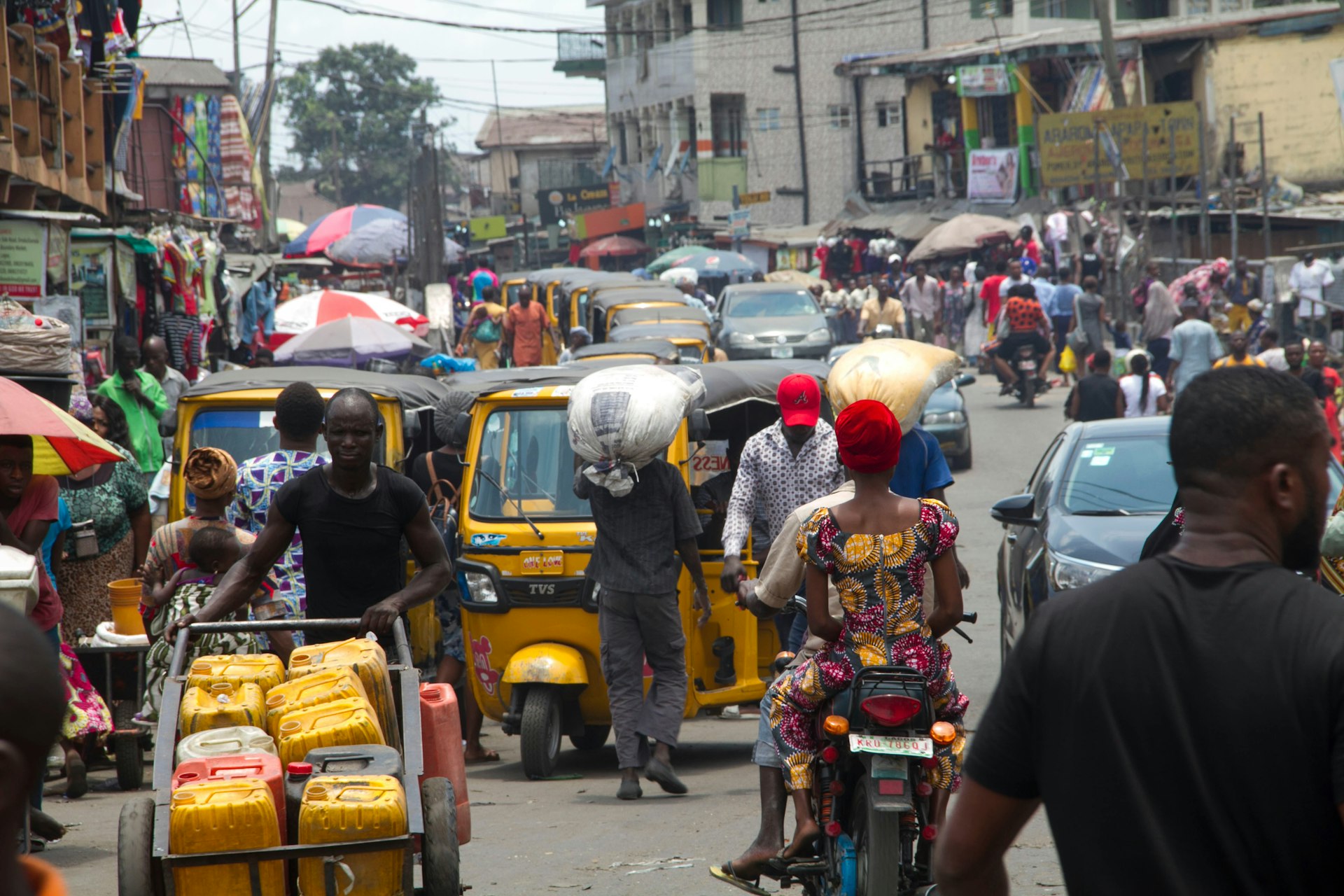 A busy street scene with lots of traffic in Ajegunle City, Lagos, Nigeria