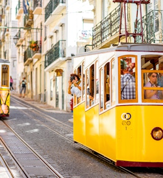 LISBON, PORTUGAL - September 28, 2017: Famous yellow funicular on the Bica street in Lisbon during the sunny day in Portugal; Shutterstock ID 763020457; your: Brian Healy; gl: 65050; netsuite: Lonely Planet Online Editorial; full: Getting around Portugal