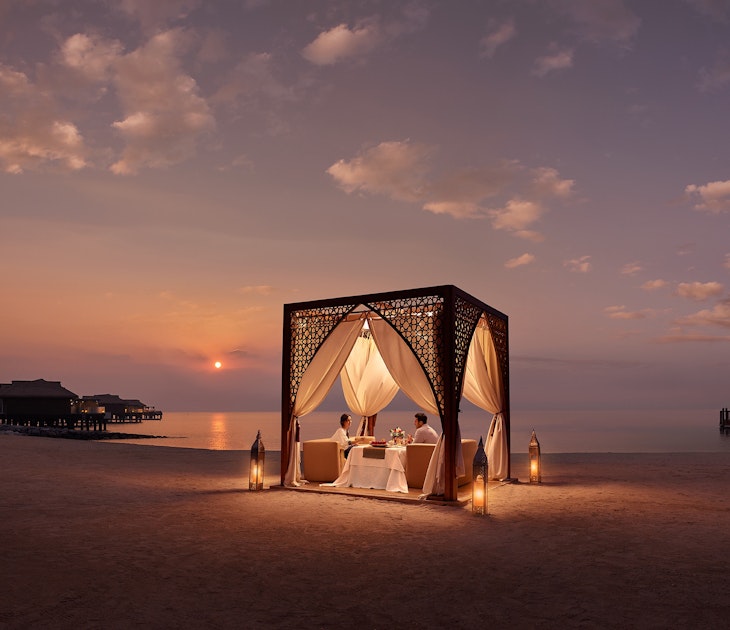 Dining in a cabana on the shore of the ocean in Qatar