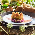 Vegetable rösti with creamed avocado, sweet and sour cabbage, smoked paprika tartar sauce and toasted pistachios.