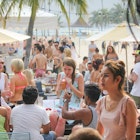 TANJONG BEACH, SENTOSA, SINGAPORE, JANUARY 26, 2015: unidentified people at Australia national day party in Tanjong Beach club, Sentosa, Singapore; Shutterstock ID 651278020; your: Brian Healy; gl: 65050; netsuite: Lonely Planet Online Editorial; full: Best beaches in Singapore