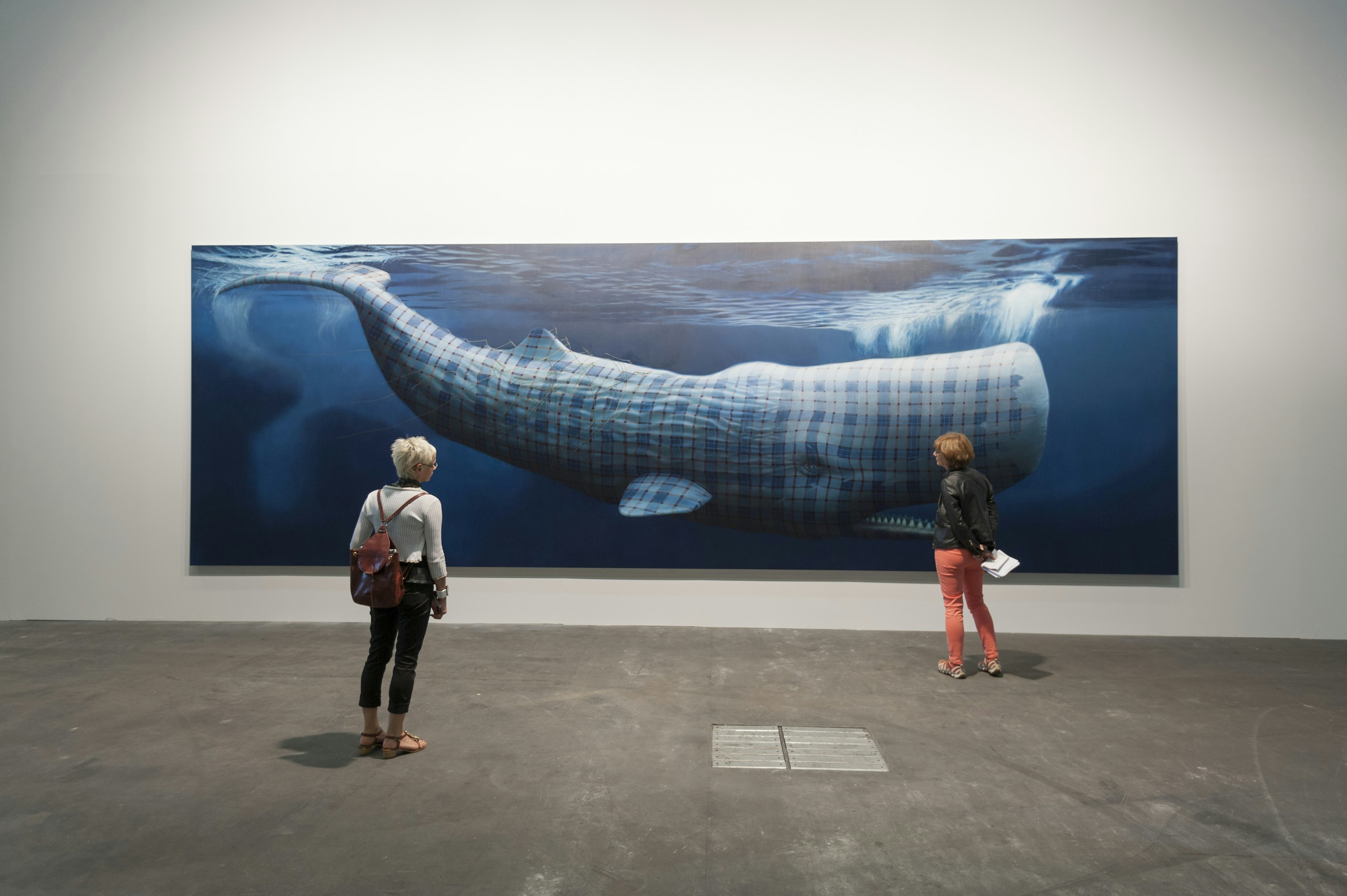 Visitors are watching the large painting "Moby Dick" by Sean Landers at the Art Basel in Basel, Switzerland, on June 14, 2013. * editorial use only *