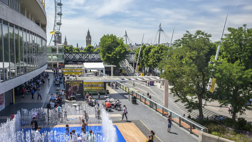 Children splash in a fountain outside the Southbank Centre on a summer's day in London