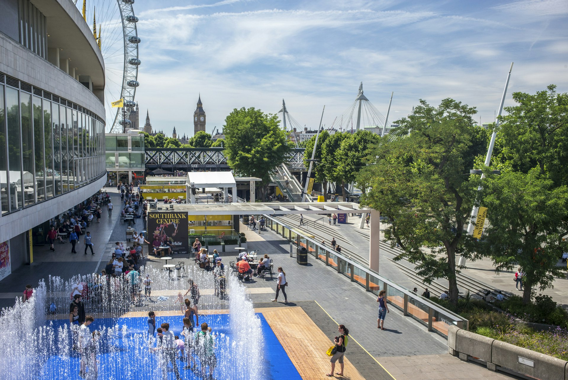 Children splash in a fountain outside the Southbank Centre on a summer's day in London
