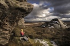 A female hiker rests on the Yorkshire moors