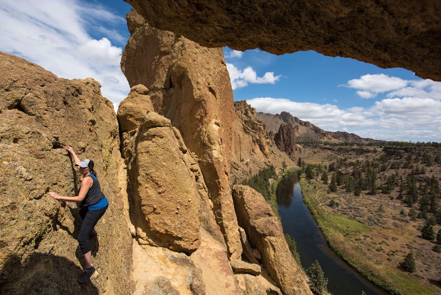 A woman free-climbing at Smith Rock State Park near Bend, Oregon