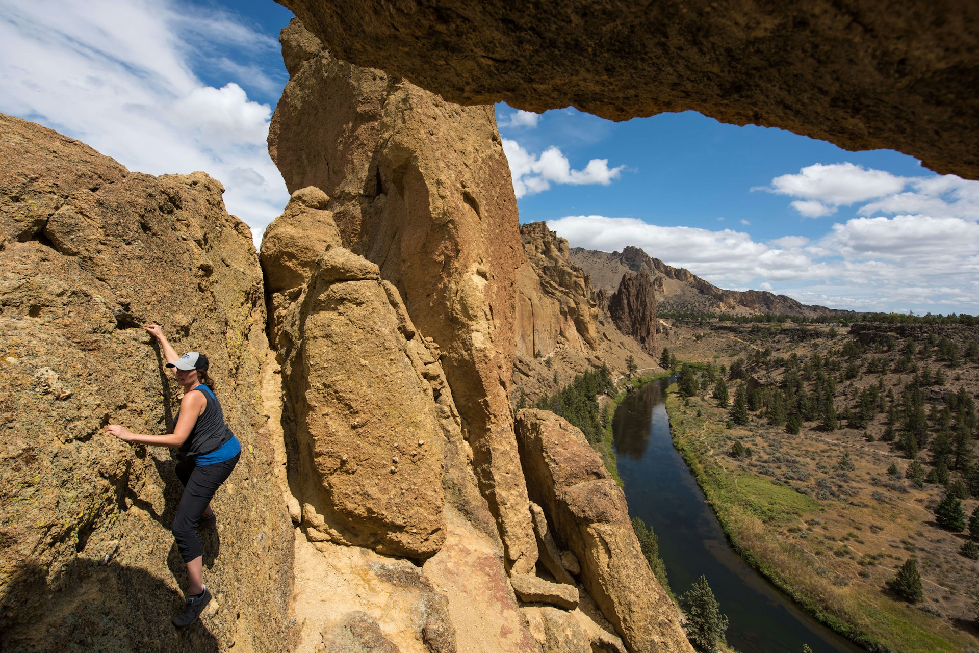 A woman free-climbing at Smith Rock State Park near Bend, Oregon