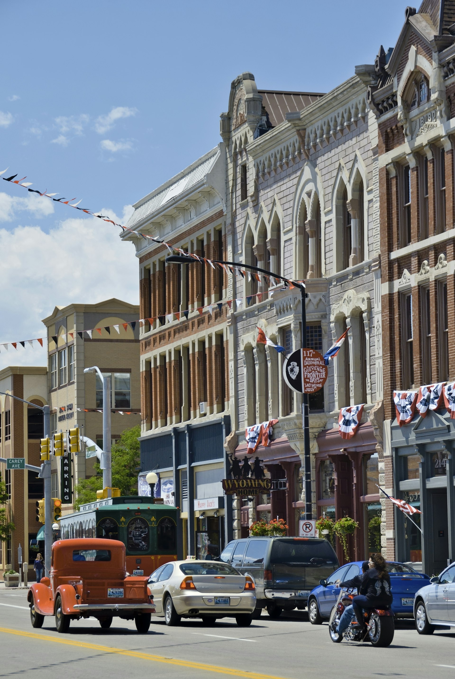 People and traffic pass by downtown Cheyenne's historic buildings. 