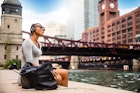 Woman listening to music by the Chicago River
