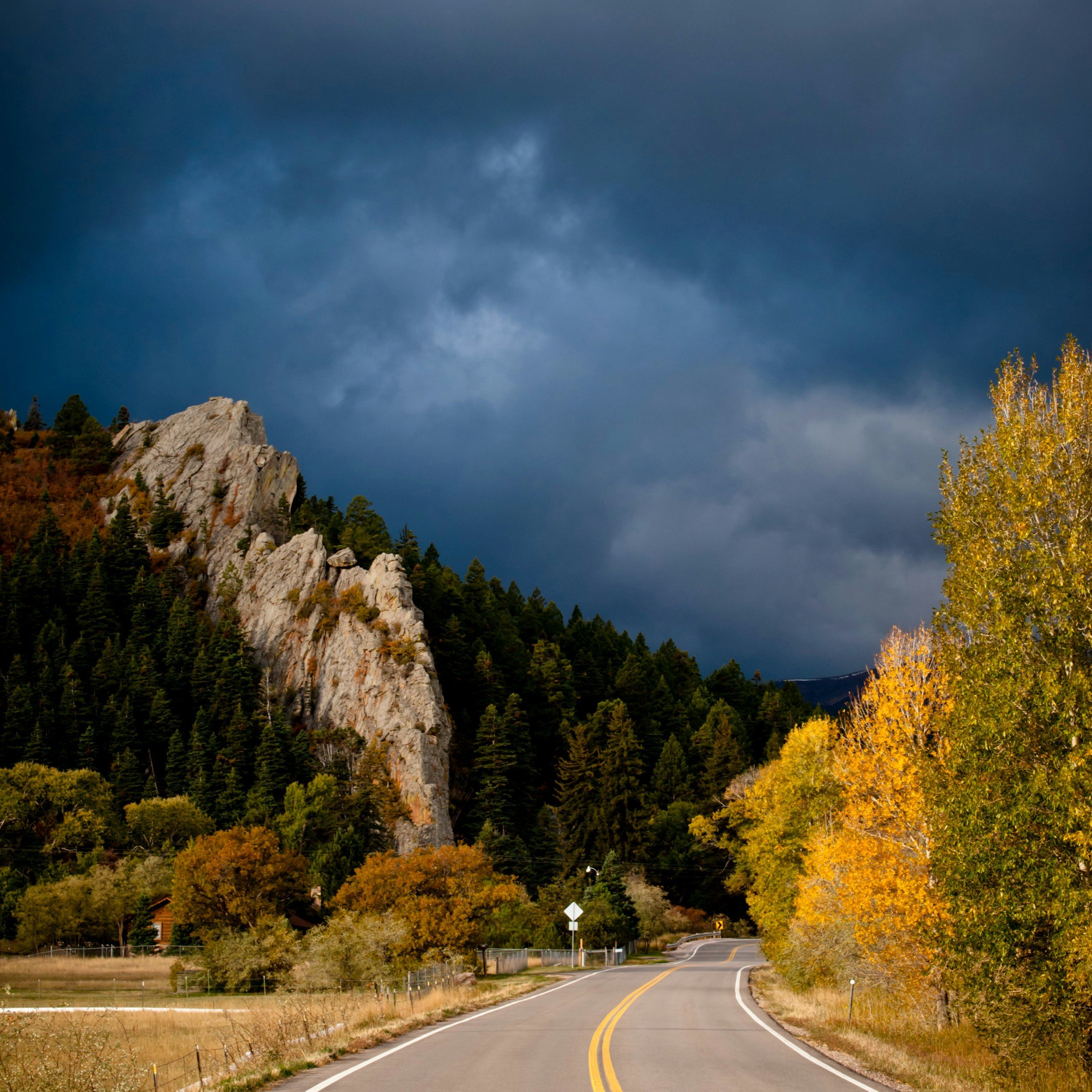 Storm clouds seen above the road along the Highway of Legends in Walsenburg, Colorado, Rocky Mountains, USA
