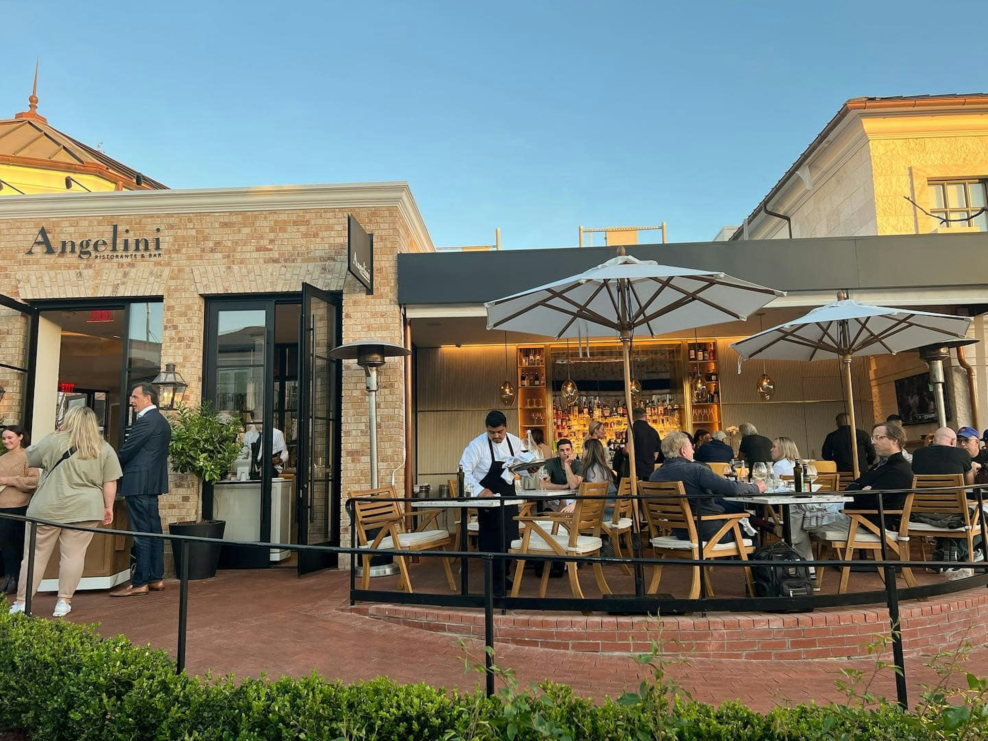 People dining outside at Angelini, Los Angeles