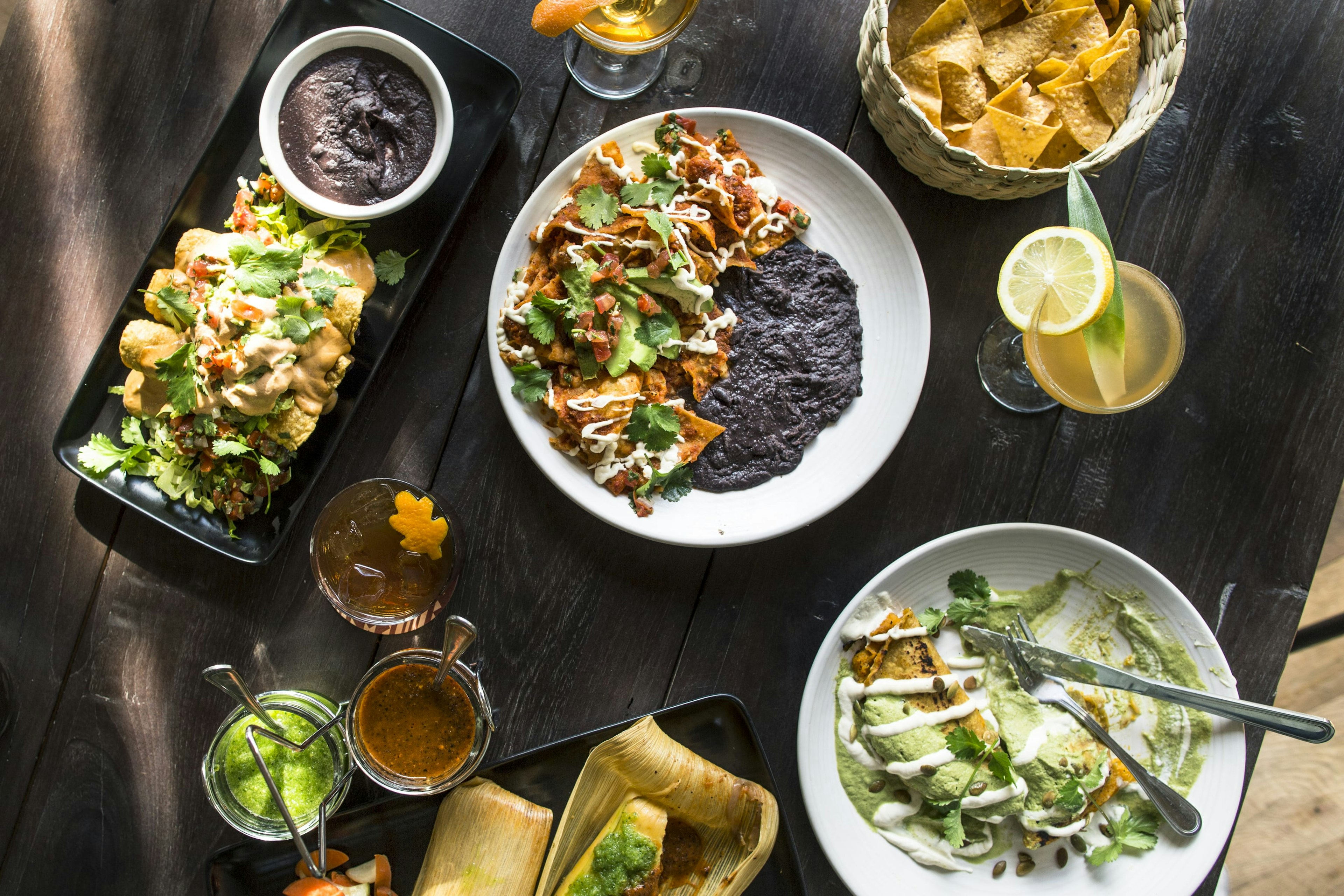 An overview of a table full of food in Gracias Madre restaurant in Los Angeles