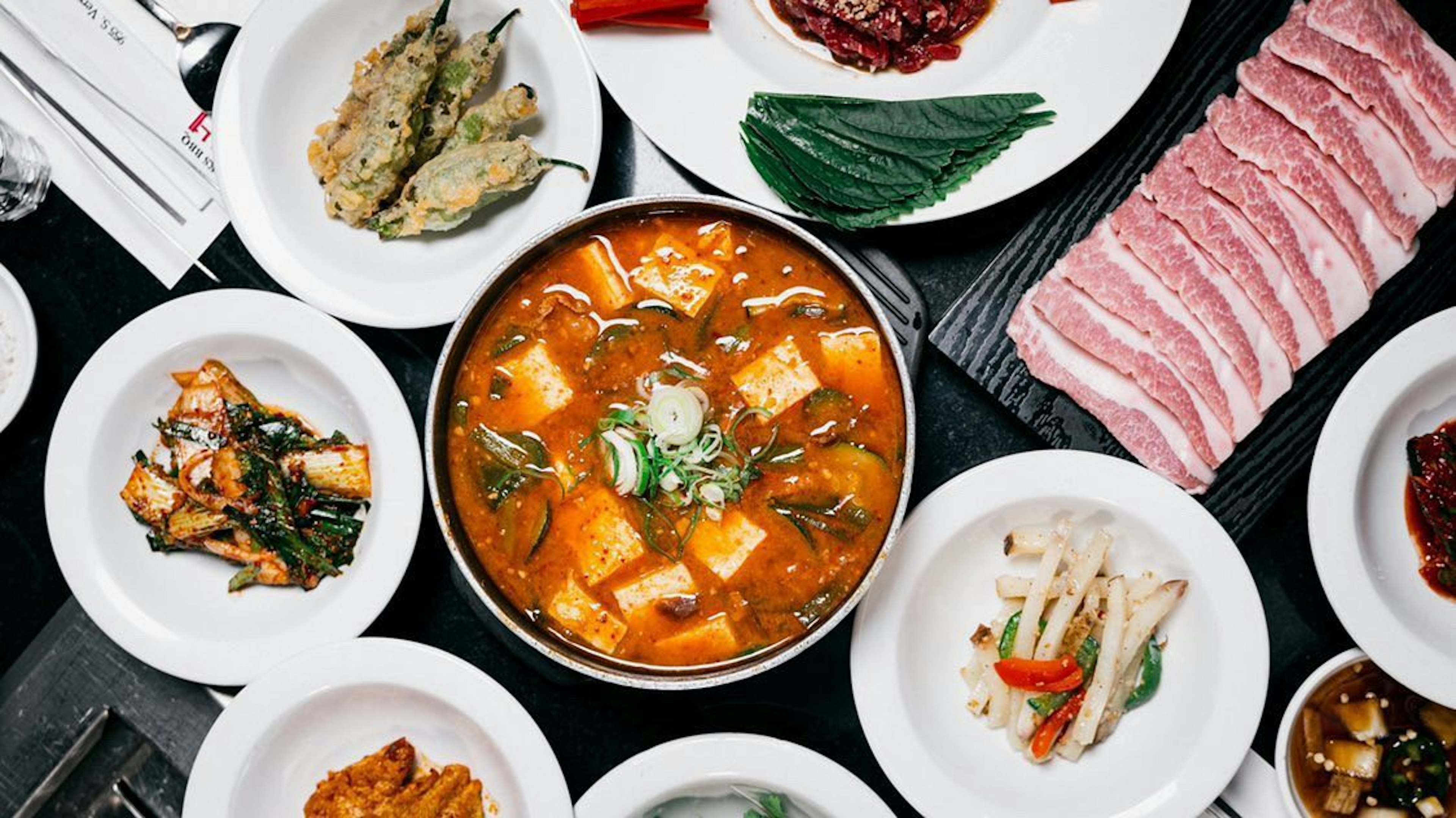 An overhead view of a range of dishes on the table at Park's BBQ in Los Angeles