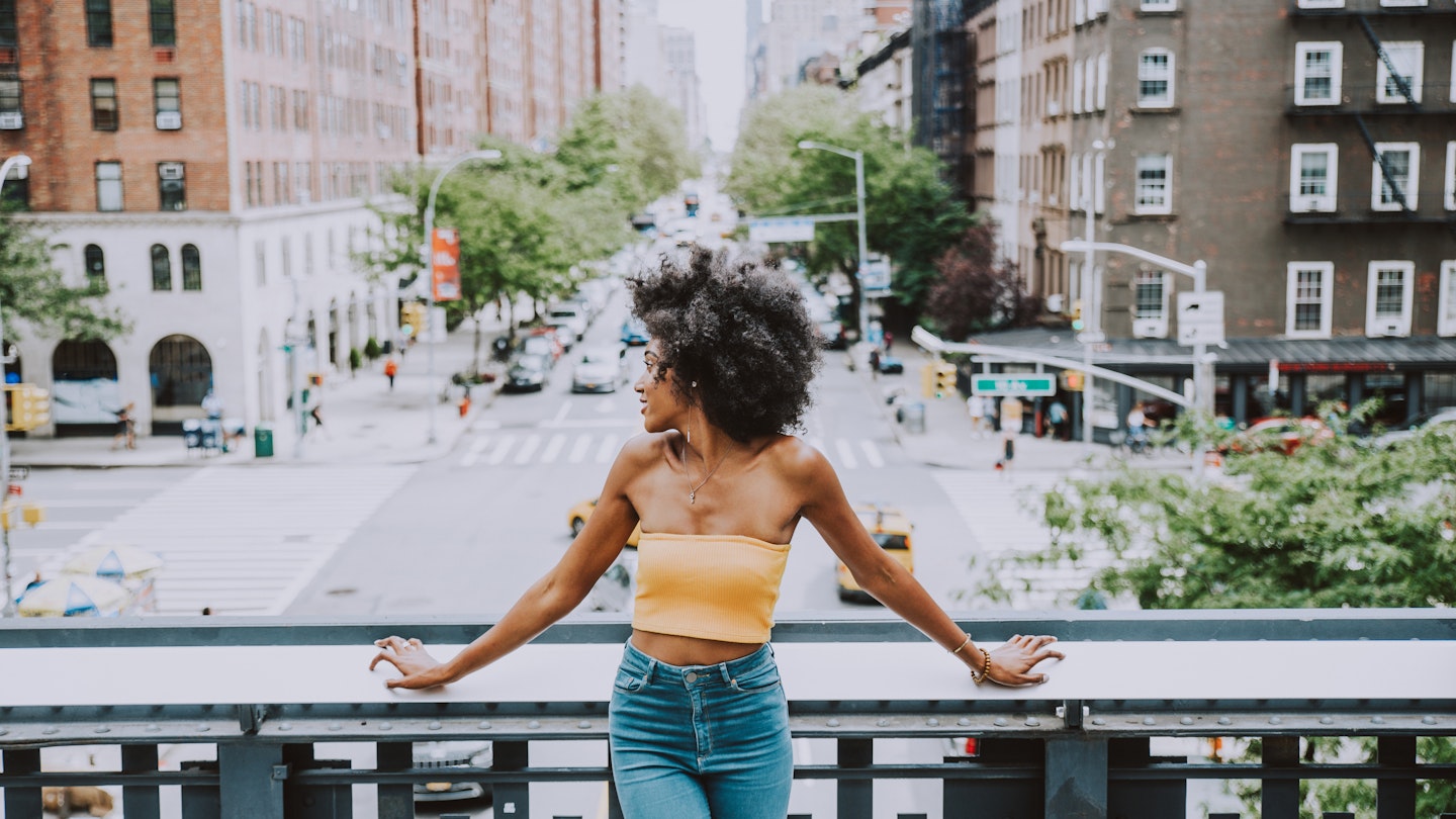 Beautiful american girl posing  in New york; Shutterstock ID 1310396668; your: Brian Healy; gl: 65050; netsuite: Lonely Planet Online Editorial; full: Best free things to do in New York