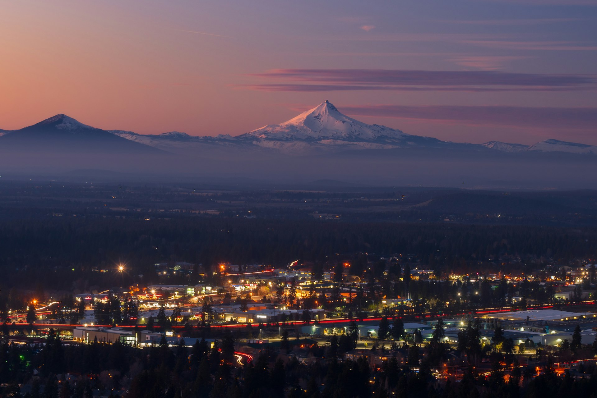 Bend, Oregon cityscape with Mt Jefferson at sunset