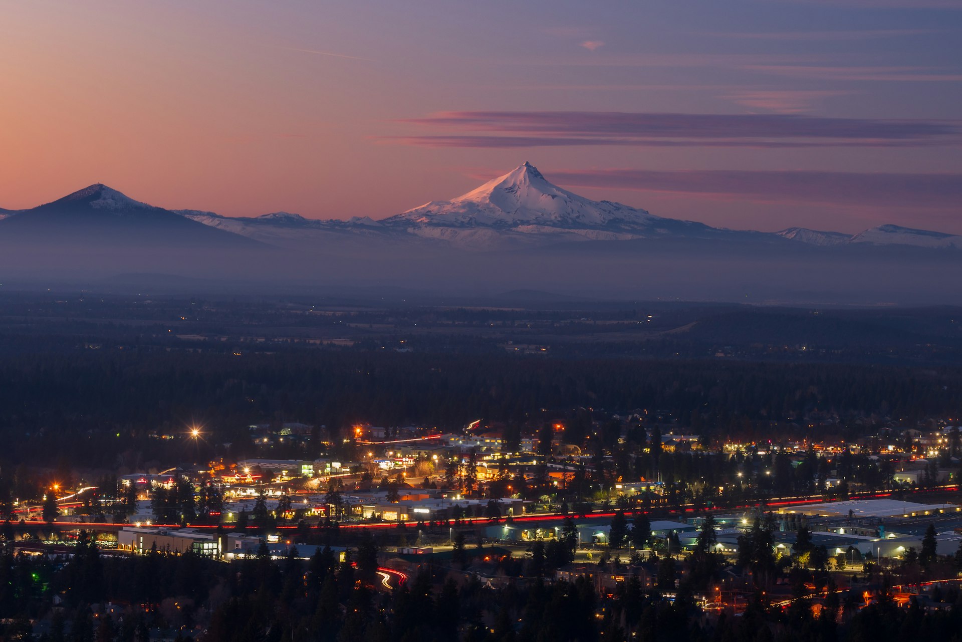 Bend Oregon cityscape with Mt Jefferson at sunset