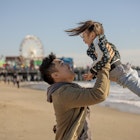 A multi-ethnic family on a picnic at the beach in the winter in Santa Monica, CA, US