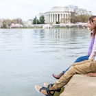 Young couple enjoying Springtime in Washington DC Peak Bloom of the Cherry blossoms; Shutterstock ID 1070150492; your: Claire Naylor; gl: 65050; netsuite: Online ed; full: Washington free update