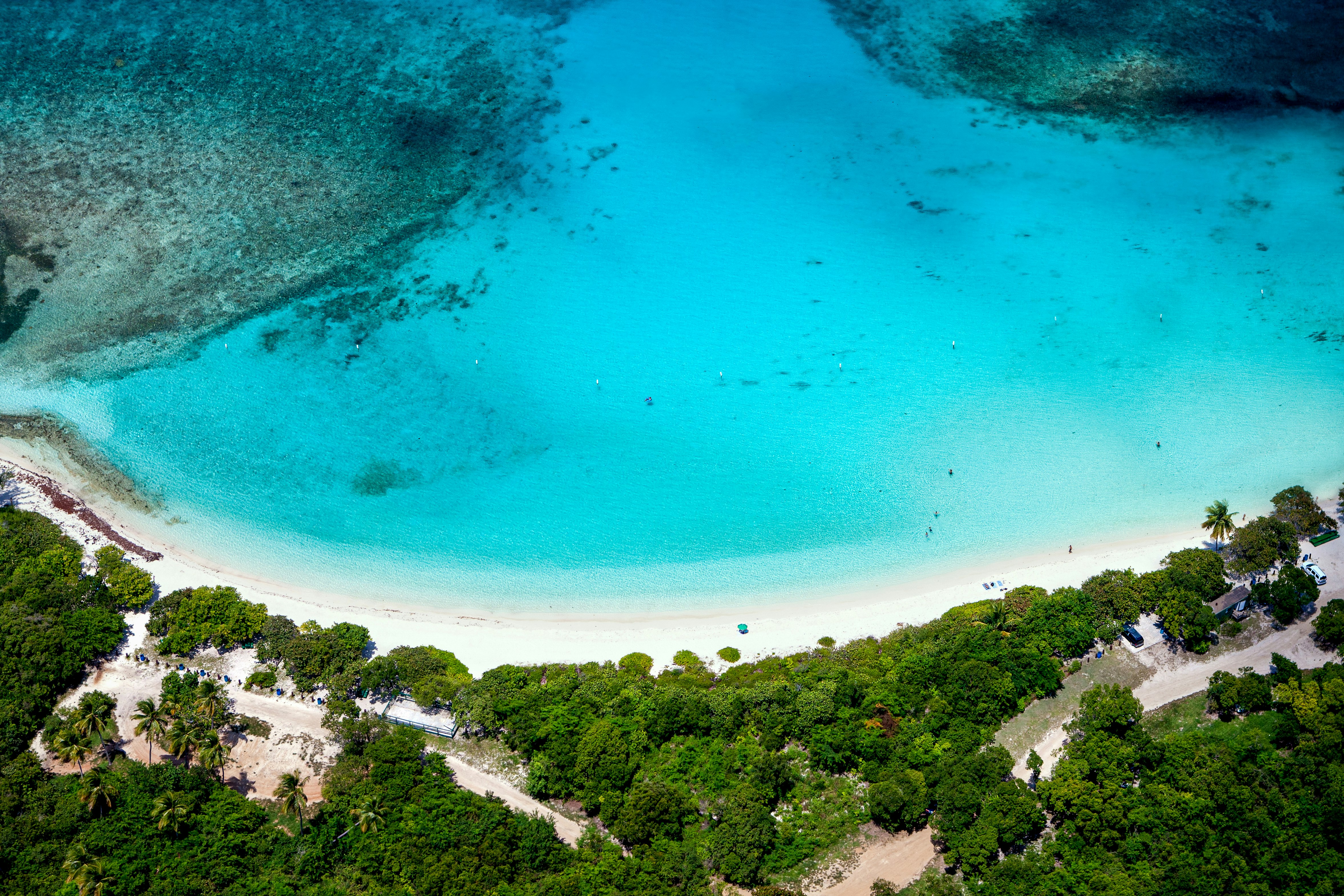 Aerial view of the turquoise water and white sand crescent at Lindquist Beach in St.Thomas, US Virgin Islands