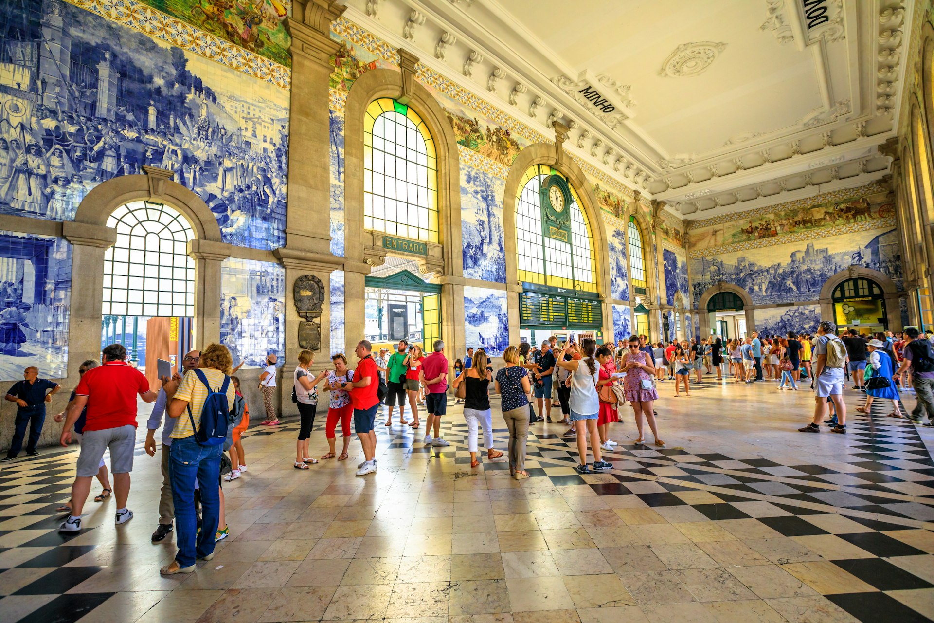 Travelers in a train station in Portugal 