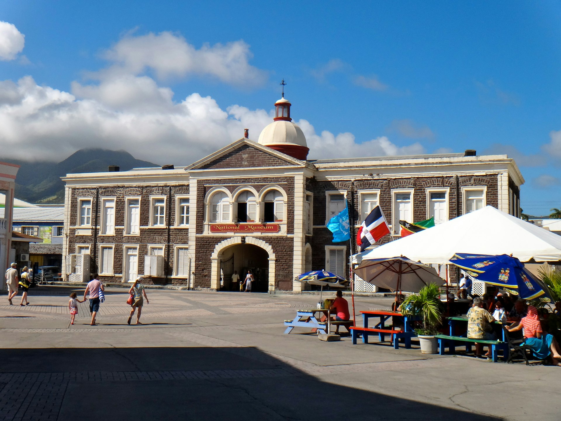 People outside of the National Museum of St. Kitts and Nevis in the city center of Basseterre