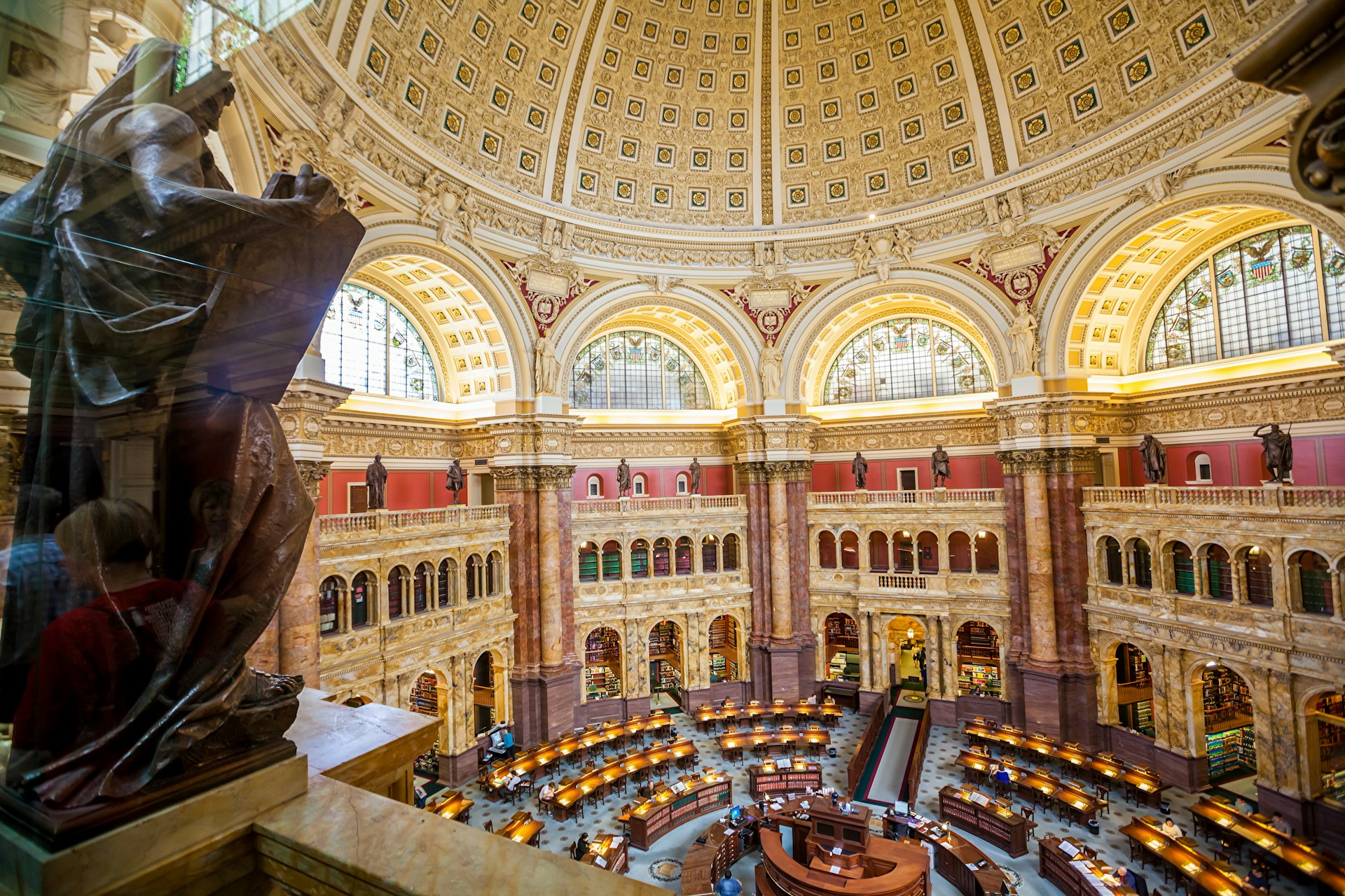 A vast reading room in the Library of Congress, with tables laid out in a circular format