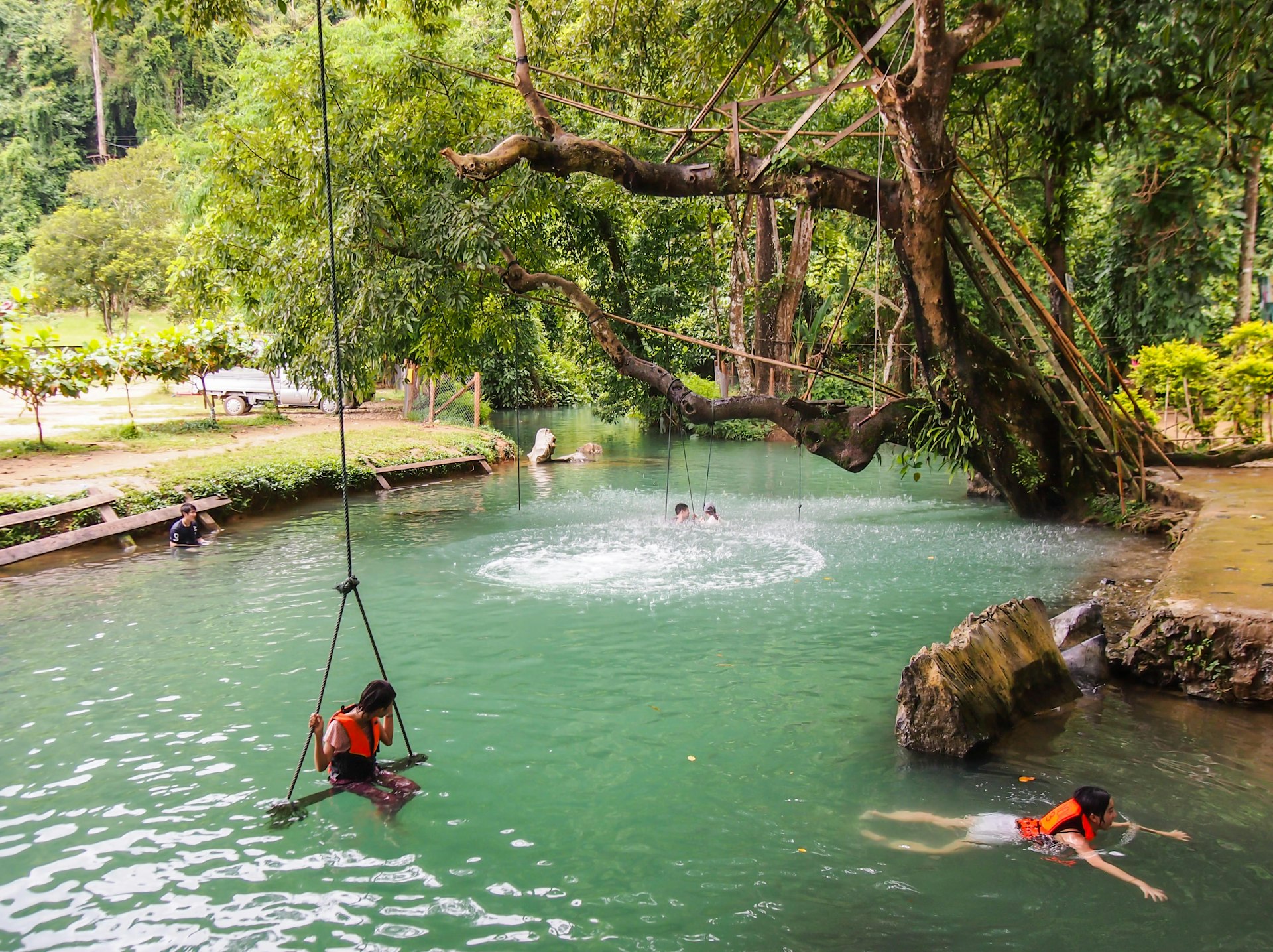 Unidentified tourist swimming at blue lagoon in Vang Vieng