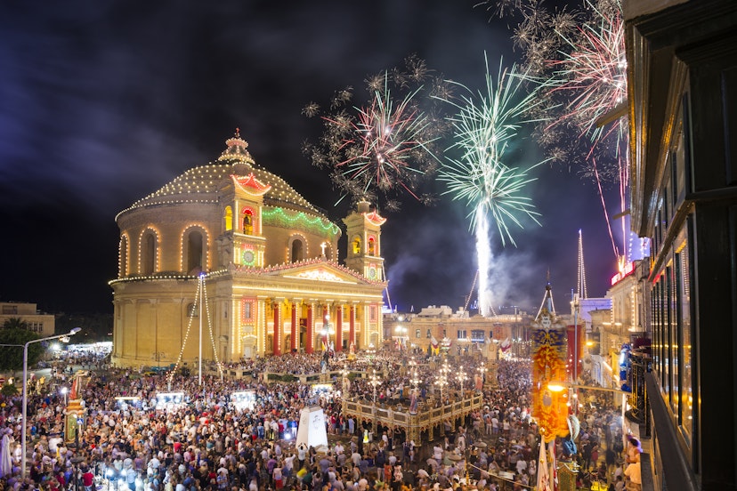 MOSTA, MALTA - 15 AUG. 2016: Fireworks at the Mosta festival at night with the famous Mosta Dome and the People of Malta are celebrating the Feast of the Assumption of 'Santa Maria'.