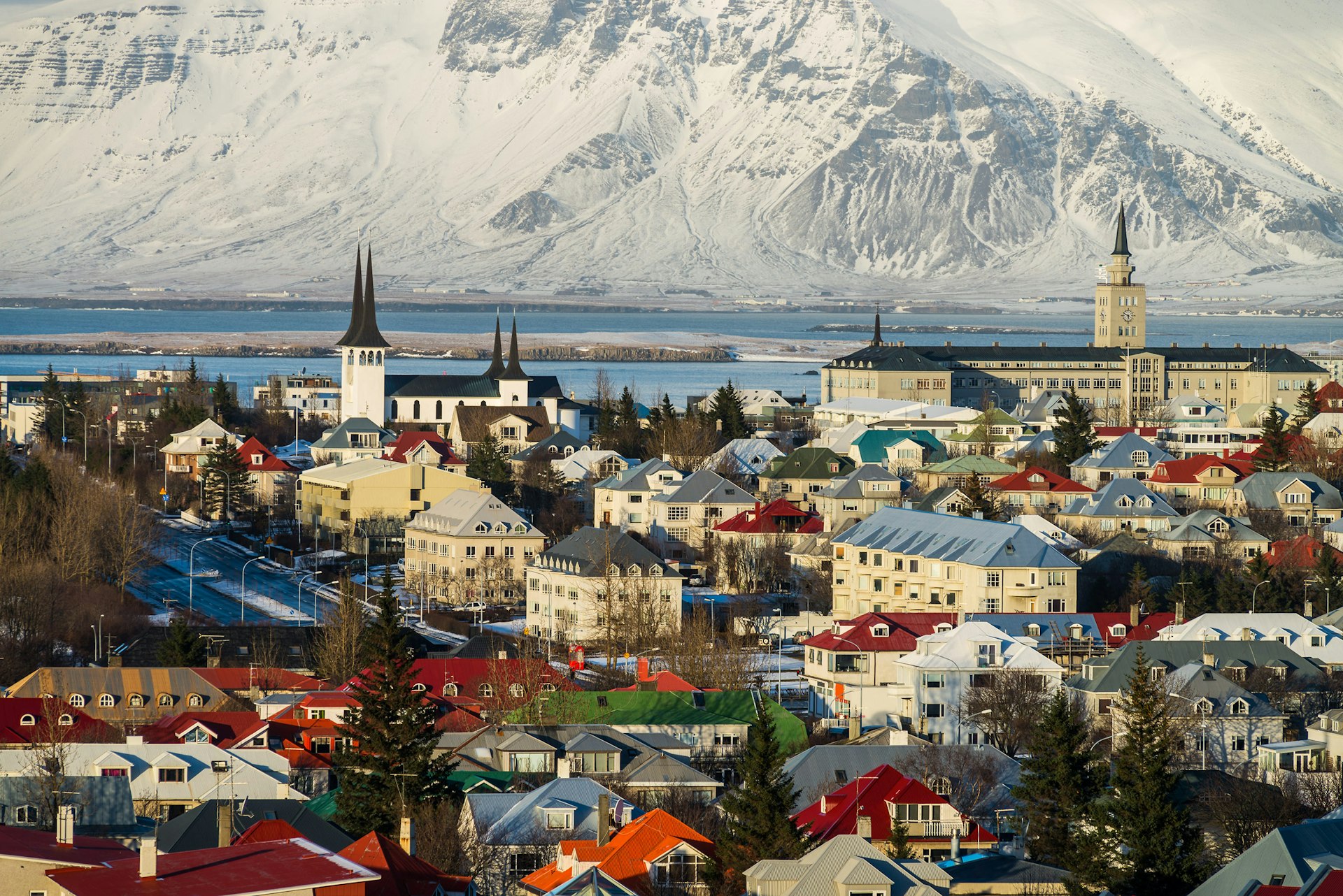 The skyline of Reykjavik with snowy hills behind