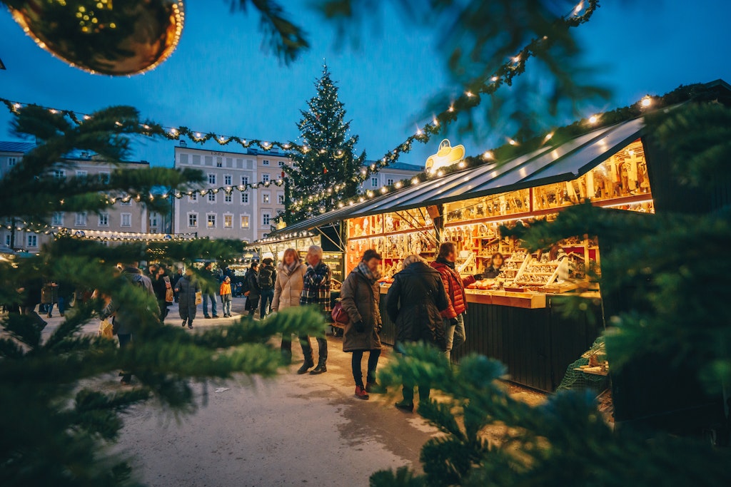 Salzburg Christmas Market seen trough a Christmas tree branches; Shutterstock ID 1220960995; your: Brian Healy; gl: 65050; netsuite: Lonely Planet Online Editorial; full: Things to know before Salzburg