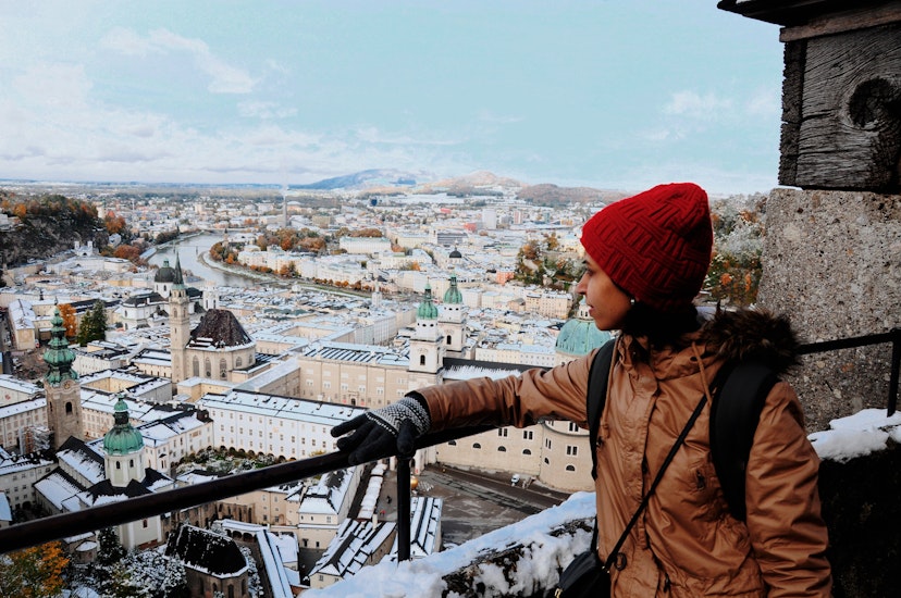 Young woman loooking at the view of Salzburg