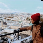 Young woman loooking at the view of Salzburg