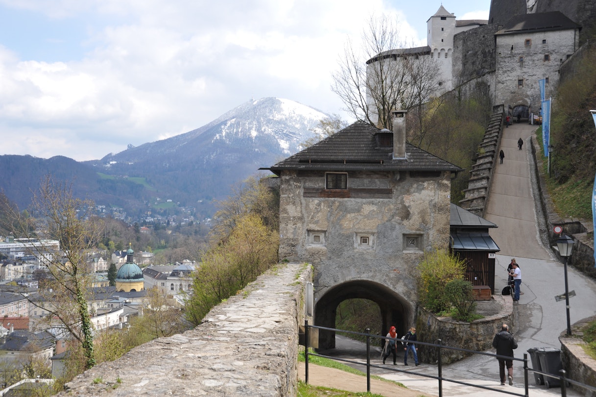 SALZBURG / AUSTRIA - APRIL 17 2012: Visitors walk up Monksberg path to the entrance of Hohensalzburg Castle Fortress.; Shutterstock ID 1777460189; your: Claire Naylor; gl: 65050; netsuite: Online editorial; full: Salzburg museums