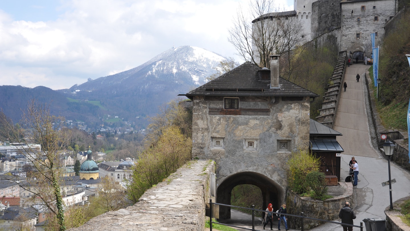 SALZBURG / AUSTRIA - APRIL 17 2012: Visitors walk up Monksberg path to the entrance of Hohensalzburg Castle Fortress.; Shutterstock ID 1777460189; your: Claire Naylor; gl: 65050; netsuite: Online editorial; full: Salzburg museums