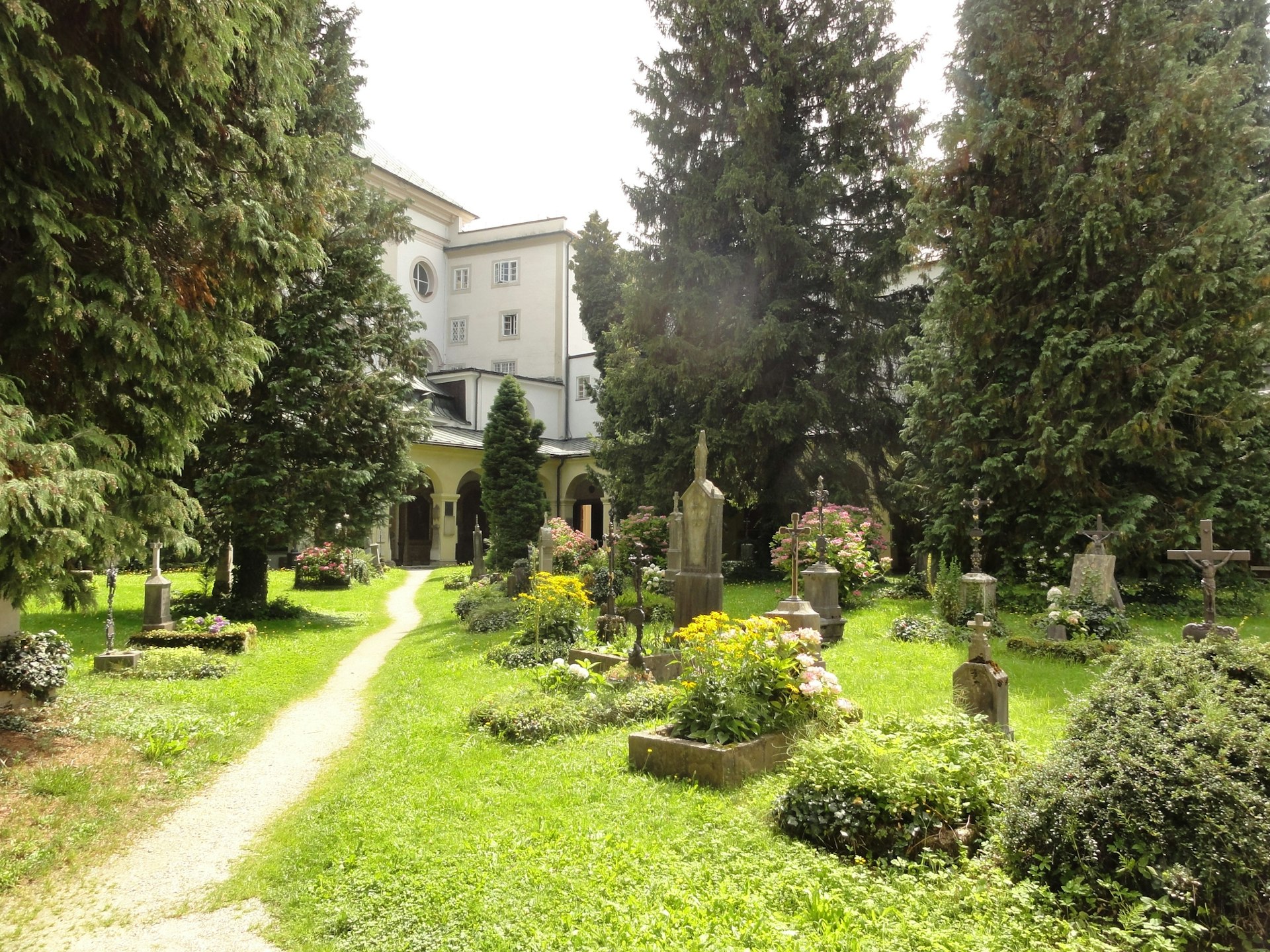 A worn path through the graveyard of St. Sebastian's Church in Salzburg