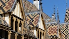 Hospices de Beaune or Hotel-Dieu de Beaune is a former charitable almshouse in Beaune, France. Courtyard, internal facade with polychrome roof