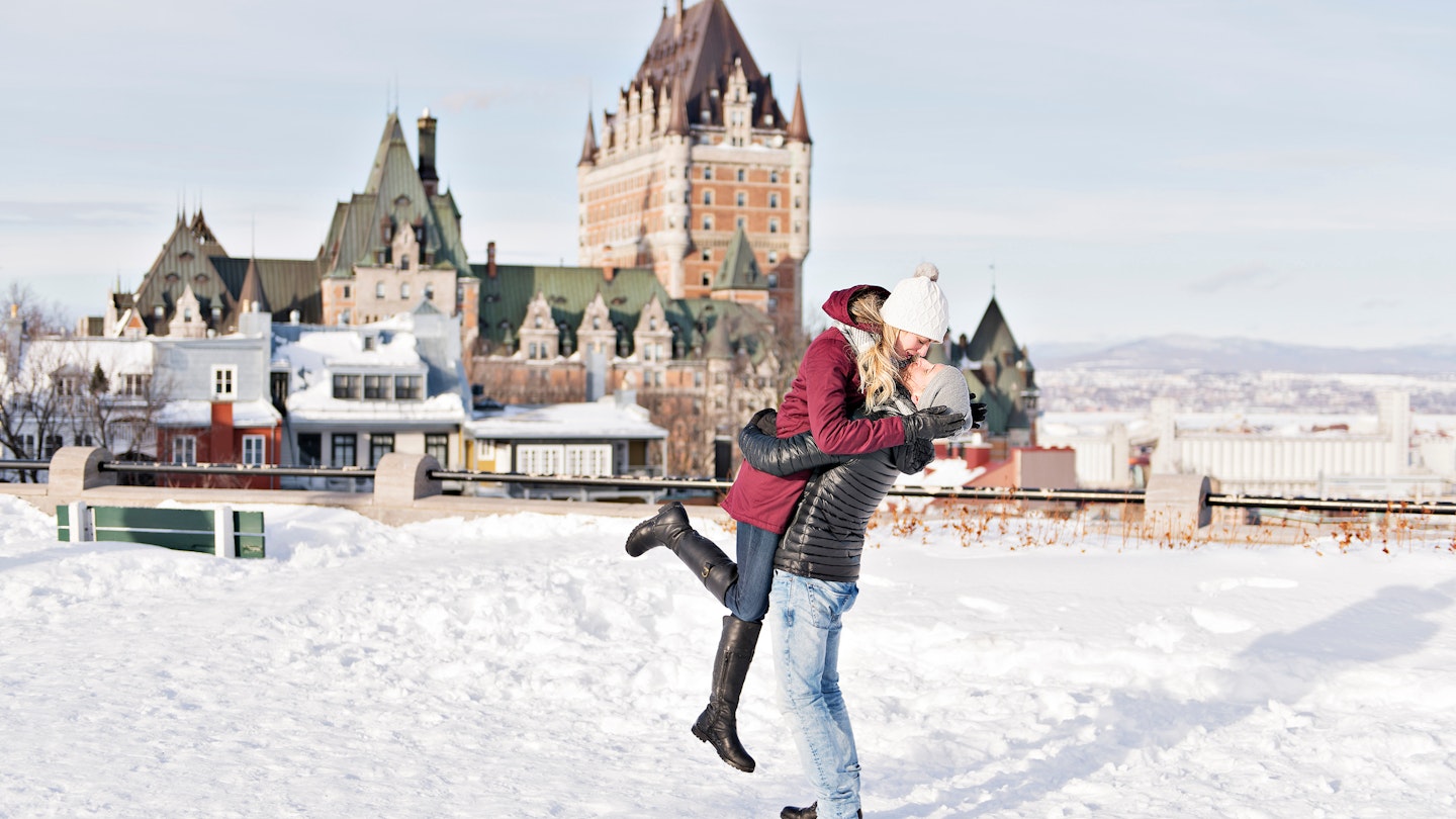 Young couple outside in winter with Quebec city Chateau frontenac; Shutterstock ID 1008126691; your: Brian Healy; gl: 65050; netsuite: Lonely Planet Online Editorial; full: Things to know before Quebec City