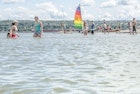 Water of the St-Lawrence river with people in background during summer day