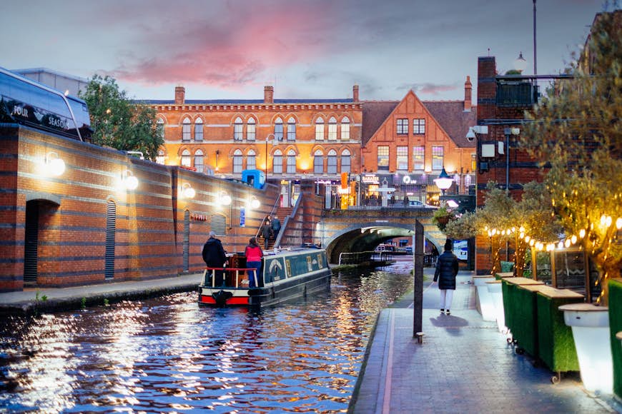 A boat sailing on the canals at Brindley Place in Birmingham, UK