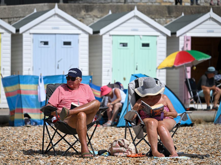 People enjoy the hot weather at the beach on June 16, 2022 in Lyme Regis, England. 