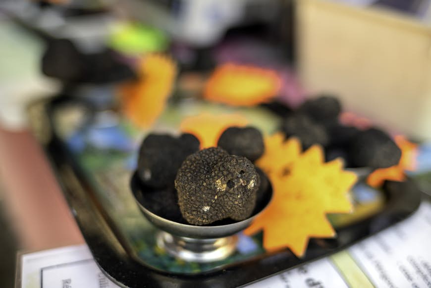 Summer truffle display for sale In an outdoor fresh produce market in Périgord, Dordogne