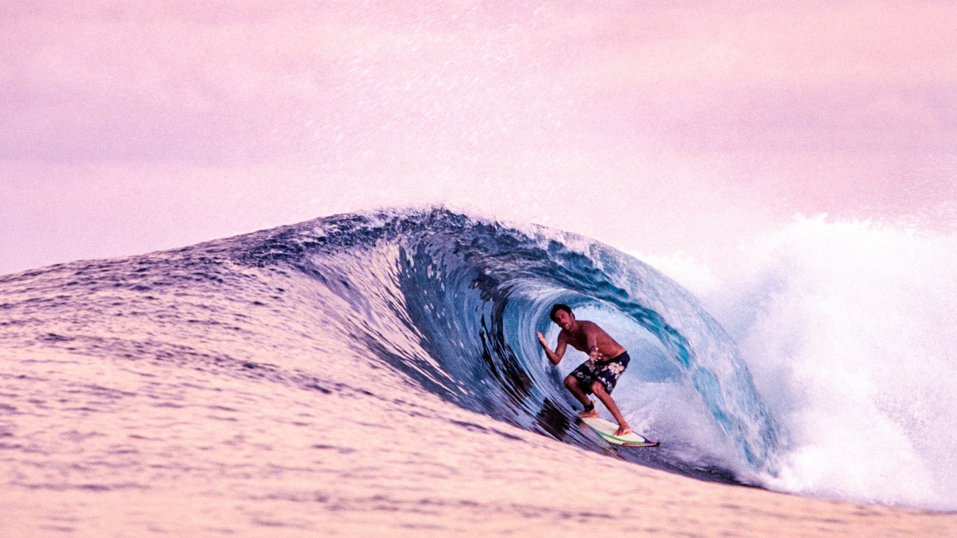 A surfer in a barrel in the Indian Ocean