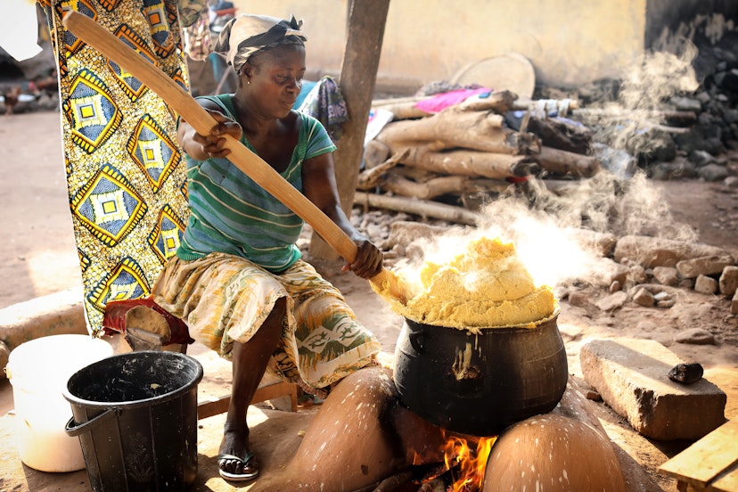 WINNEBA - GHANA - JULY 28, 2017: Unidentified woman prepares traditional corn porridge on July 28, 2017 in Winneba, Ghana; Shutterstock ID 725337634; your: Brian Healy; gl: 65050; netsuite: Lonely Planet Online Editorial; full: Best things to do in Ghana