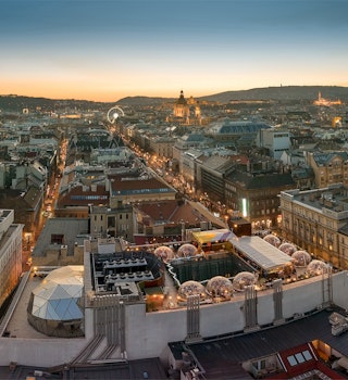 Europe Hungary Budapest parnorama cityscape 360 rooftop bar. Andrassy street. Ede Paulay street. Budapest eye. St. Stephen basilica. Hungarian parliament. Budapest parliamnet. Sunset. Aerial. ; Shutterstock ID 1639632793; your: Brian Healy; gl: 65050; netsuite: Lonely Planet Online Editorial; full: Rooftop bars in Budapest