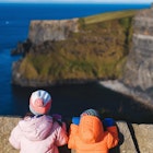 boy and girl looking at cliff of moher in ireland; Shutterstock ID 1603639525; your: Brian Healy; gl: 65050; netsuite: Lonely Planet Online Editorial; full: Ireland with kids