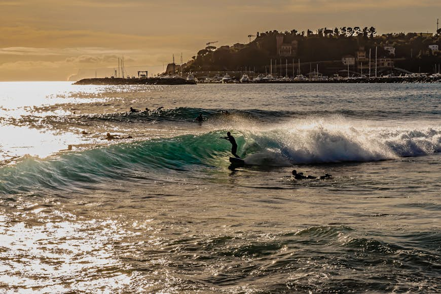 People surfing at Varazze, a municipality in the Beigua park, overlooking the Ligurian Sea