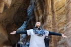 Tourist girl with hijab visiting Petra in Jordan; Shutterstock ID 619203992; your: Brian Healy; gl: 65050; netsuite: Lonely Planet Online Editorial; full: Getting the most out of the Jordan Pass