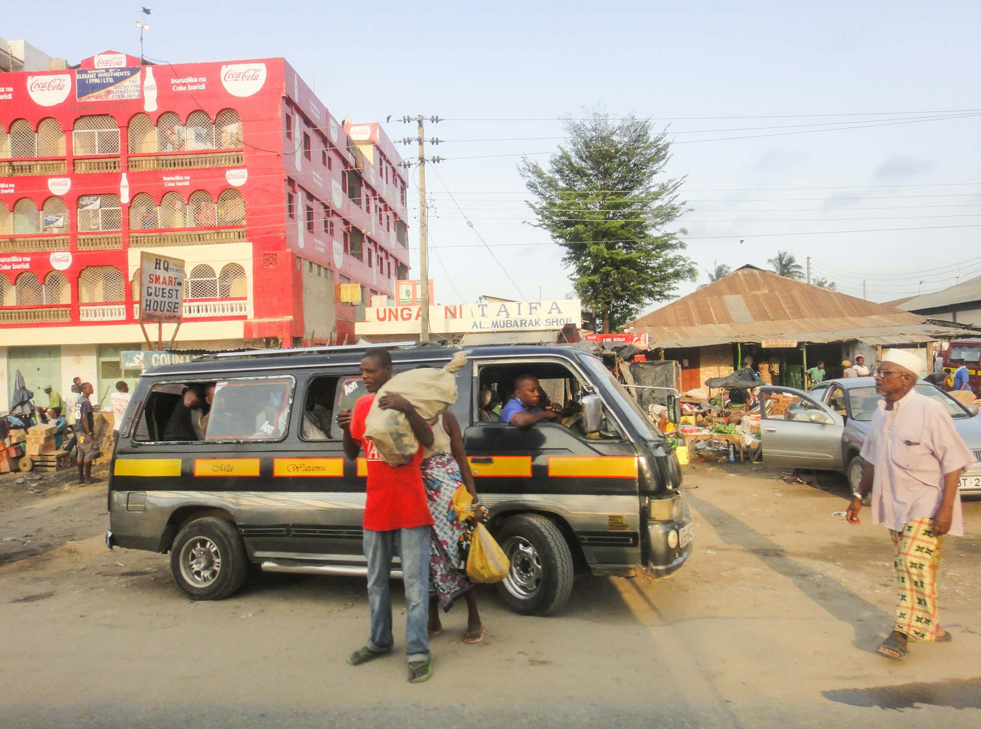 Passengers disembarking from a matatu in Mombasa, Kenya