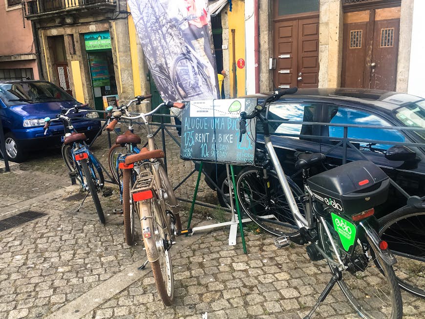 Biclas & Triclas bikes out front of shops in Porto Portugal