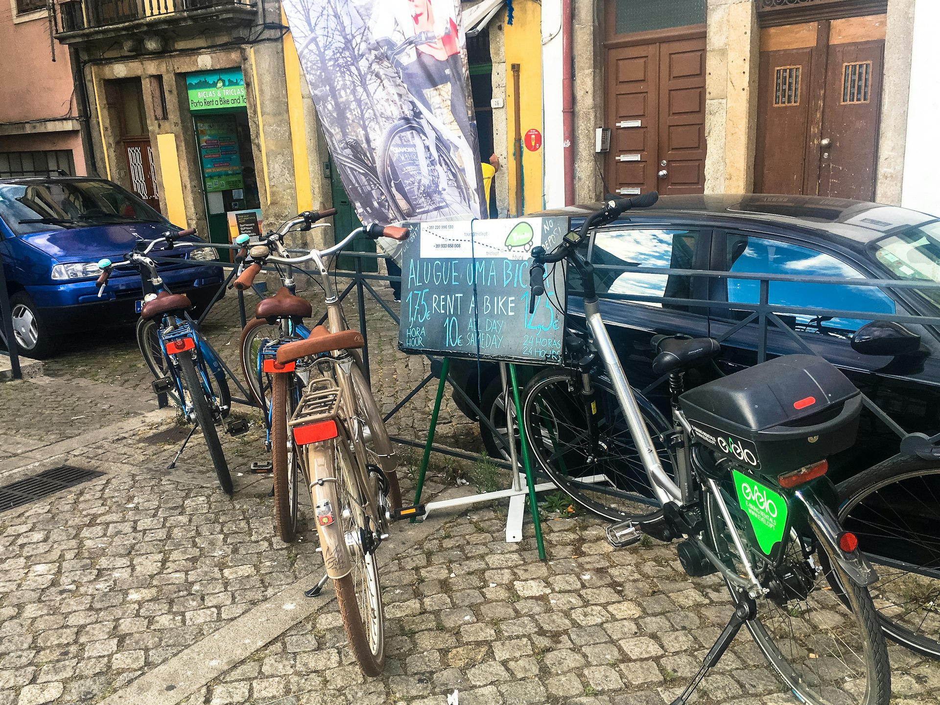 Biclas & Triclas bikes out front of shops in Porto Portugal